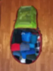 osprey backpack filled wih travel gear